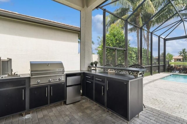 view of patio / terrace with an outdoor kitchen, a grill, a sink, an outdoor pool, and glass enclosure