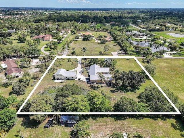 11151 88th Rd N, Palm Beach Gardens, FL 33412 - aerial view of property and surrounding area with property parcel outlined and a large body of water