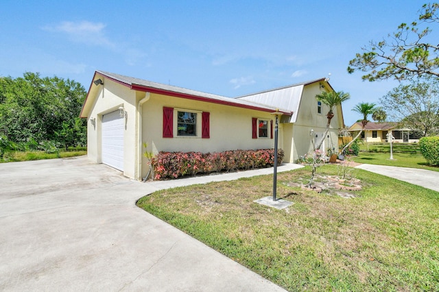 11151 88th Rd N, Palm Beach Gardens, FL 33412 - view of front of house with driveway, stucco siding, a front yard, and an attached garage