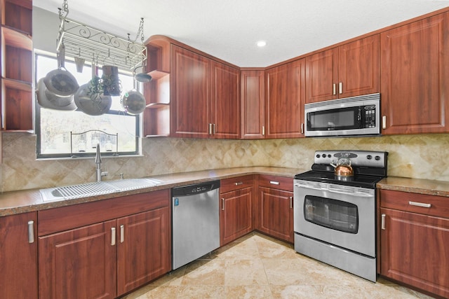 11151 88th Rd N, Palm Beach Gardens, FL 33412 - kitchen featuring appliances with stainless steel finishes, a sink, open shelves, and plenty of natural light