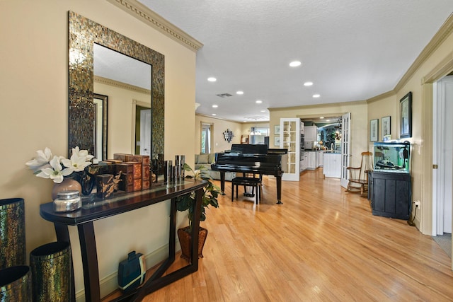 11151 88th Rd N, Palm Beach Gardens, FL 33412 - living area with ornamental molding, light wood-style floors, and recessed lighting