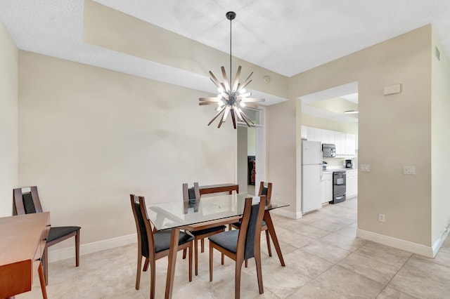 dining space featuring a chandelier, baseboards, and light tile patterned floors