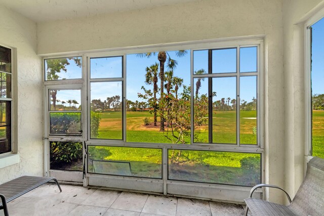 unfurnished sunroom with golf course view