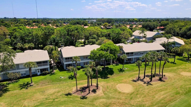 aerial perspective of suburban area featuring a tree filled landscape