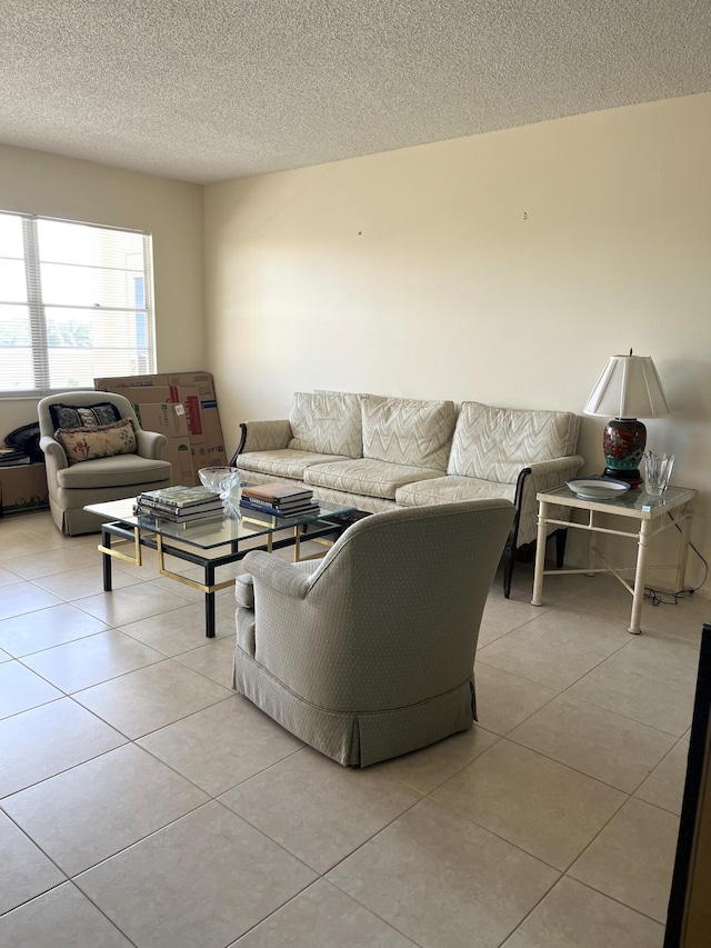 4047 Ainslie C, Boca Raton, FL 33434 - living room with tile patterned floors and a textured ceiling