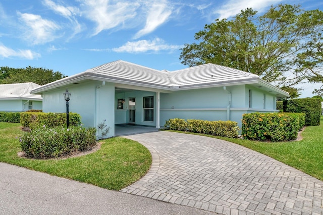 5 Slash Pine Dr, Boynton Beach, FL 33436 - single story home featuring decorative driveway, stucco siding, a tiled roof, and a front lawn