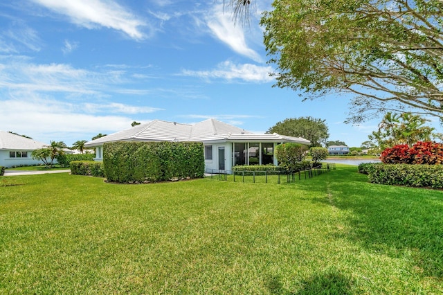 5 Slash Pine Dr, Boynton Beach, FL 33436 - back of property with a lawn, a water view, and a tile roof