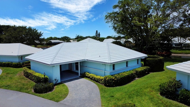 5 Slash Pine Dr, Boynton Beach, FL 33436 - view of front of property featuring decorative driveway, a front lawn, a carport, and stucco siding