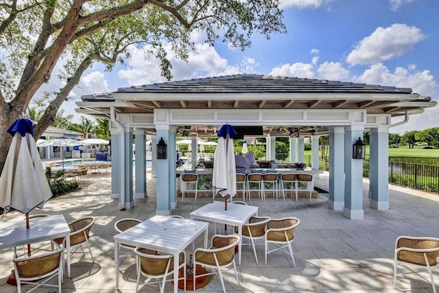 5 Slash Pine Dr, Boynton Beach, FL 33436 - view of patio / terrace with a gazebo, an outdoor pool, and a water view
