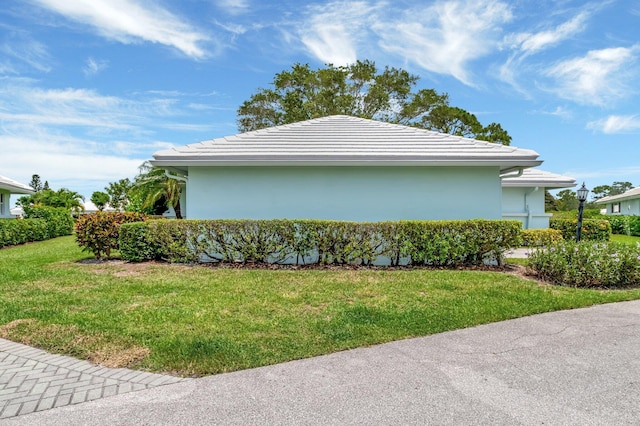 5 Slash Pine Dr, Boynton Beach, FL 33436 - view of home's exterior with a yard, stucco siding, and a tiled roof