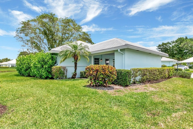 5 Slash Pine Dr, Boynton Beach, FL 33436 - view of side of home with a lawn and stucco siding