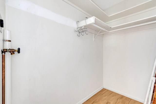 410 High Point Dr Unit C, Delray Beach, FL 33445 - spacious closet with light wood-style floors