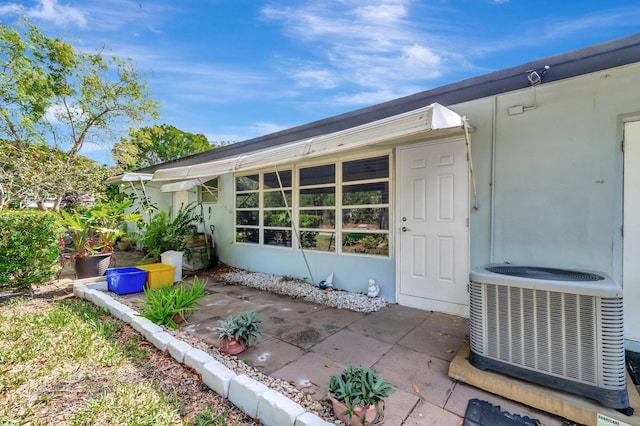 410 High Point Dr Unit C, Delray Beach, FL 33445 - property entrance featuring central air condition unit