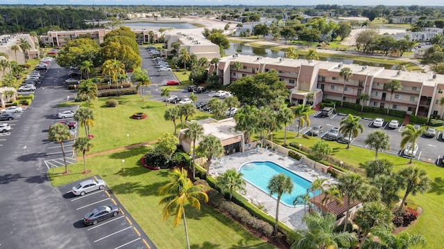 410 High Point Dr Unit C, Delray Beach, FL 33445 - bird's eye view of a pool area and a large body of water