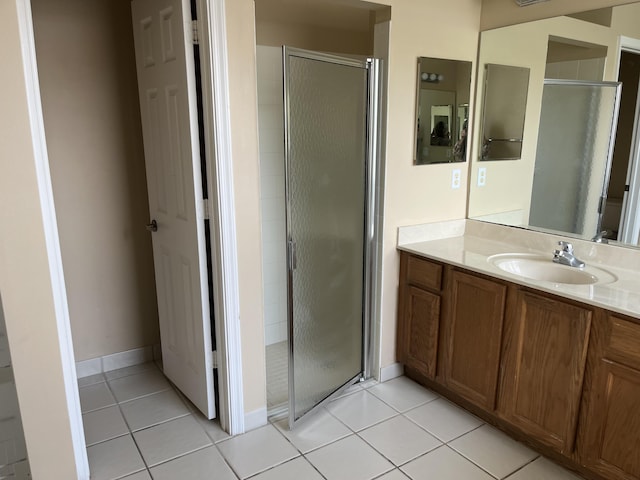 6110 46th Ln, Vero Beach, FL 32967 - full bathroom featuring a stall shower, vanity, and tile patterned floors
