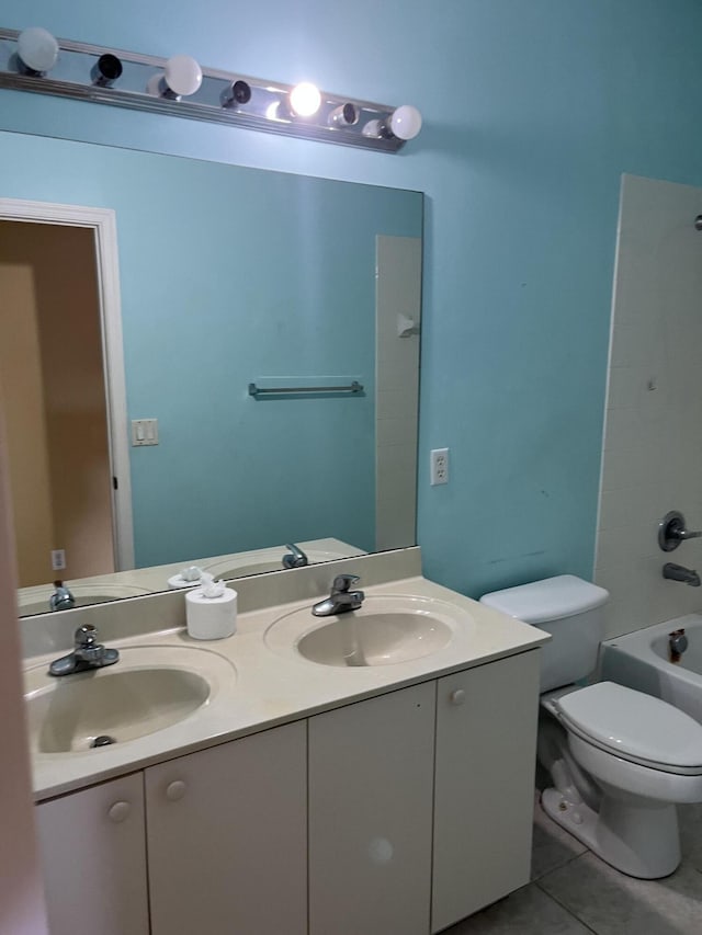 6110 46th Ln, Vero Beach, FL 32967 - bathroom featuring tile patterned floors, toilet, double vanity, and  shower combination