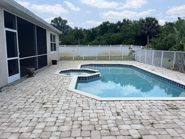 6110 46th Ln, Vero Beach, FL 32967 - view of swimming pool with a patio, a fenced backyard, and a pool with connected hot tub