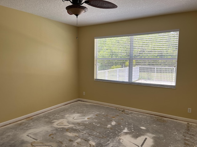 6110 46th Ln, Vero Beach, FL 32967 - unfurnished room with ceiling fan, a textured ceiling, and baseboards
