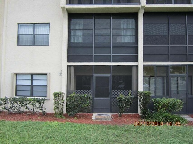 2050 Oleander Blvd Unit 1-105, Fort Pierce, FL 34950 - view of exterior entry with stucco siding