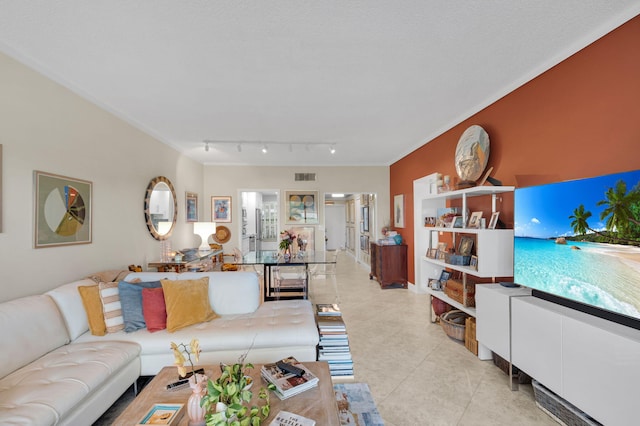730 Greensward Ct Unit 107-J, Delray Beach, FL 33445 - living room featuring light tile patterned floors and track lighting