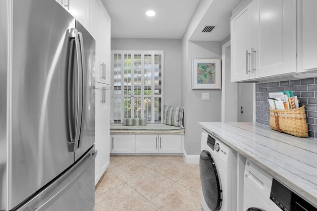 730 Greensward Ct Unit 107-J, Delray Beach, FL 33445 - laundry room with washer / dryer, baseboards, light tile patterned floors, and recessed lighting