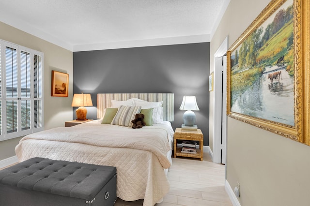 730 Greensward Ct Unit 107-J, Delray Beach, FL 33445 - bedroom with baseboards and light wood-style floors