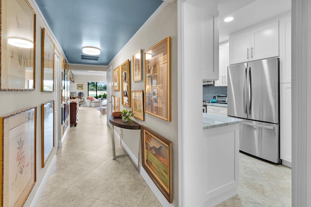 730 Greensward Ct Unit 107-J, Delray Beach, FL 33445 - hallway with light tile patterned floors, recessed lighting, and baseboards