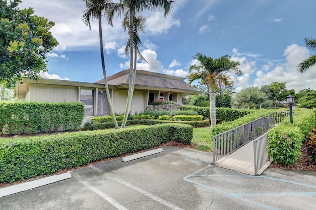 730 Greensward Ct Unit 107-J, Delray Beach, FL 33445 - view of property featuring uncovered parking