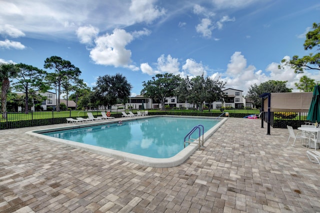 730 Greensward Ct Unit 107-J, Delray Beach, FL 33445 - community pool featuring a patio