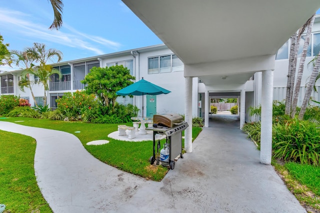 2161 NE 42nd Ct Unit 116, Lighthouse Point, FL 33064 - view of home's community featuring a yard and a carport