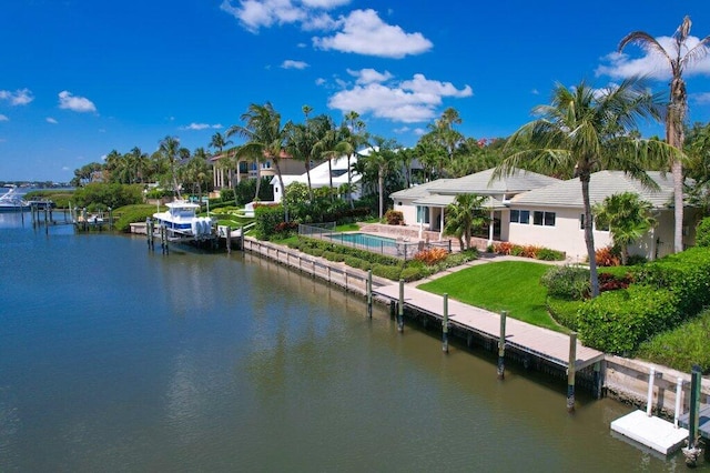 16 E High Point Rd, Sewalls Point, FL 34996 - dock featuring a water view and a lawn