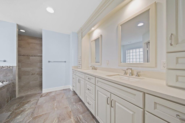 16 E High Point Rd, Sewalls Point, FL 34996 - bathroom featuring double vanity, a walk in shower, and recessed lighting