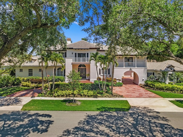 2 Firestone Cir, West Palm Beach, FL 33401 - mediterranean / spanish-style home with a balcony, stucco siding, a chimney, french doors, and a tiled roof