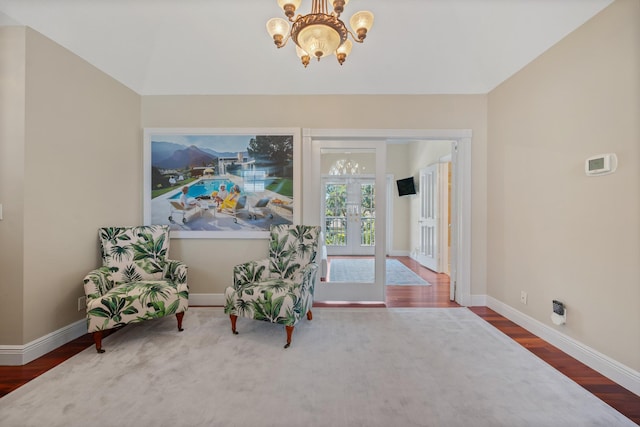 2 Firestone Cir, West Palm Beach, FL 33401 - living area featuring a chandelier, wood finished floors, baseboards, and french doors