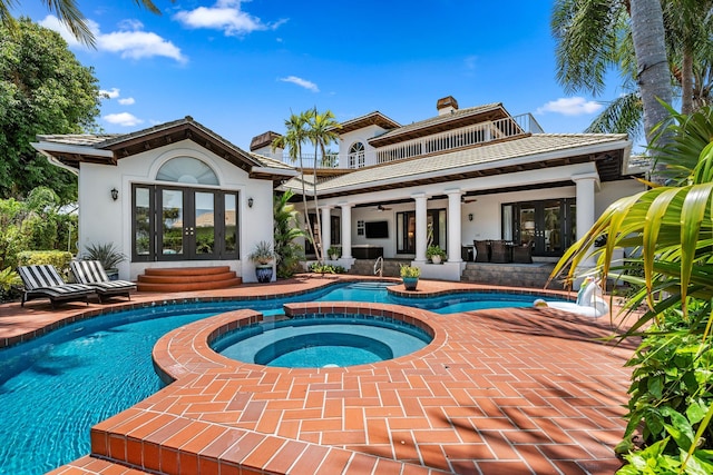 2 Firestone Cir, West Palm Beach, FL 33401 - back of house featuring french doors, a balcony, ceiling fan, and stucco siding