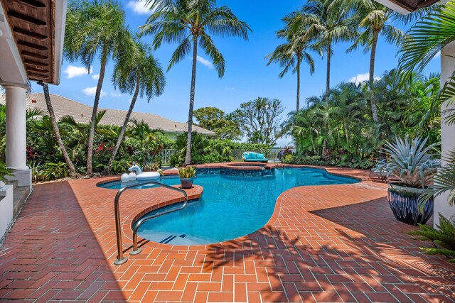 2 Firestone Cir, West Palm Beach, FL 33401 - view of pool featuring a patio and a pool with connected hot tub