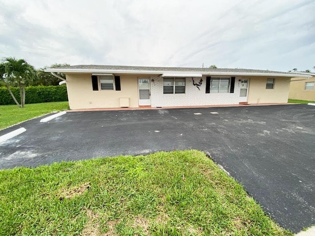 2715 Ponce De Leon Blvd, Delray Beach, FL 33445 - view of front facade featuring brick siding