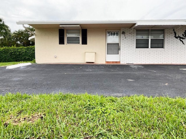 2715 Ponce De Leon Blvd, Delray Beach, FL 33445 - view of front facade with brick siding and stucco siding