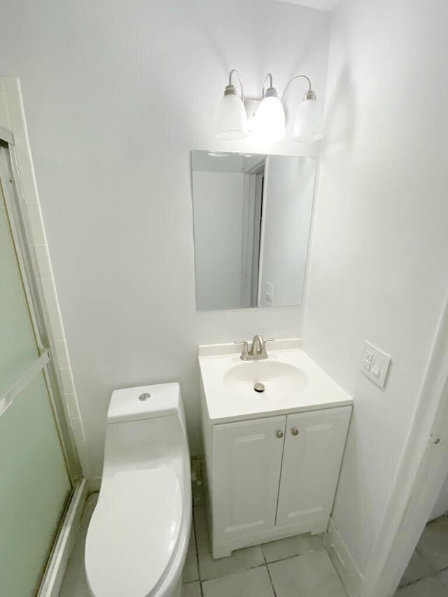 2715 Ponce De Leon Blvd, Delray Beach, FL 33445 - full bath featuring vanity, toilet, an enclosed shower, and tile patterned flooring