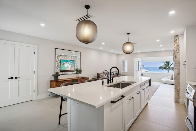 3401 S Ocean Blvd Unit 6, Highland Beach, FL 33487 - kitchen with a sink, recessed lighting, white cabinetry, pendant lighting, and open floor plan