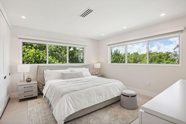 3401 S Ocean Blvd Unit 6, Highland Beach, FL 33487 - bedroom with multiple windows, baseboards, recessed lighting, and light tile patterned floors