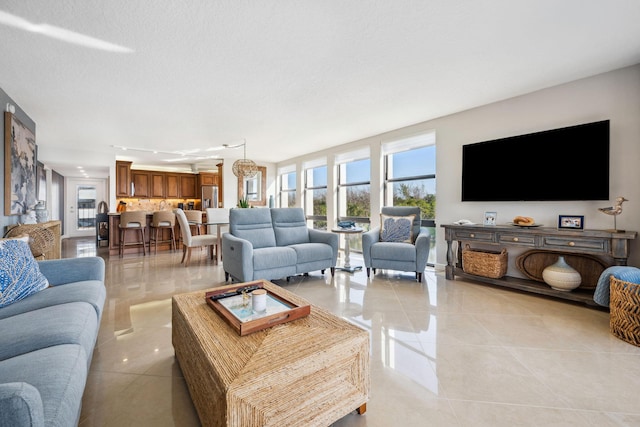 1627 Riverview Rd Unit 409, Deerfield Beach, FL 33441 - living room with plenty of natural light and light tile patterned flooring