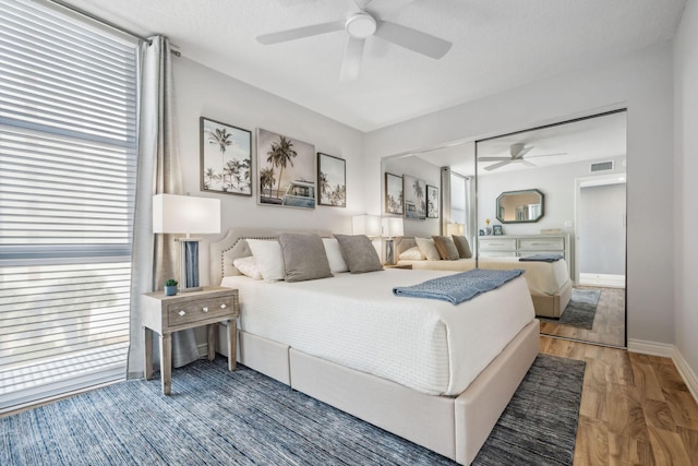 1627 Riverview Rd Unit 409, Deerfield Beach, FL 33441 - bedroom featuring baseboards, wood finished floors, and a ceiling fan
