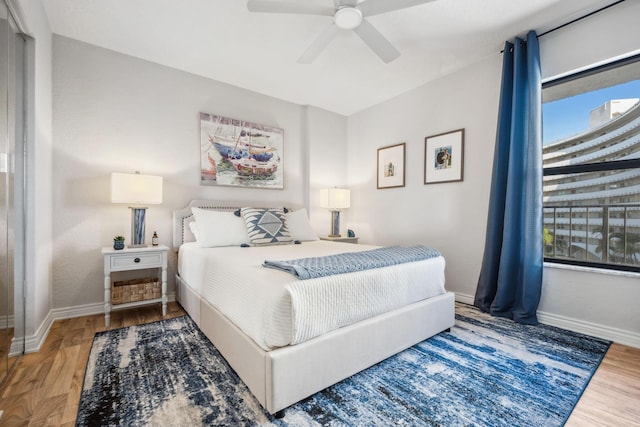 1627 Riverview Rd Unit 409, Deerfield Beach, FL 33441 - bedroom featuring baseboards, wood finished floors, and a ceiling fan