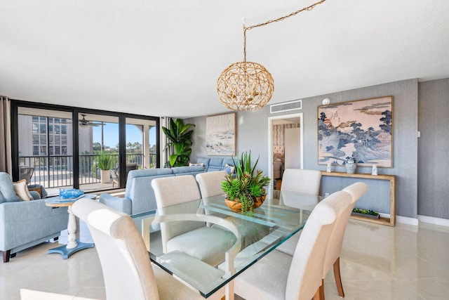 1627 Riverview Rd Unit 409, Deerfield Beach, FL 33441 - dining room with a chandelier, baseboards, and tile patterned floors