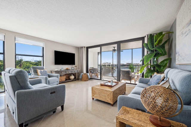 1627 Riverview Rd Unit 409, Deerfield Beach, FL 33441 - living area with a textured ceiling and light tile patterned flooring