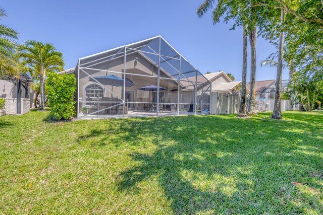 1833 Barnstable Rd, Wellington, FL 33414 - rear view of house with a patio and glass enclosure