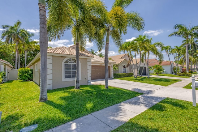 1833 Barnstable Rd, Wellington, FL 33414 - mediterranean / spanish house with driveway, stucco siding, an attached garage, and a tiled roof