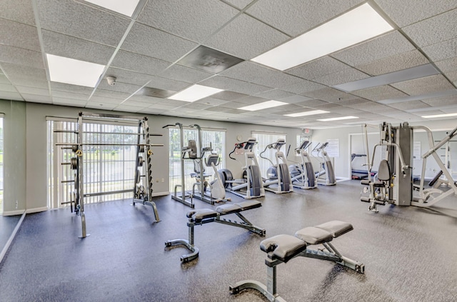 1833 Barnstable Rd, Wellington, FL 33414 - gym featuring baseboards and a paneled ceiling