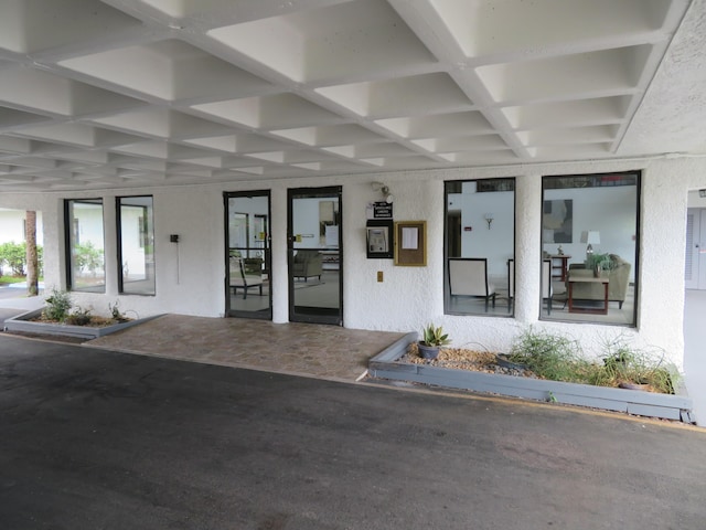 9233 SW 8th St Unit 207, Boca Raton, FL 33428 - view of exterior entry featuring stucco siding